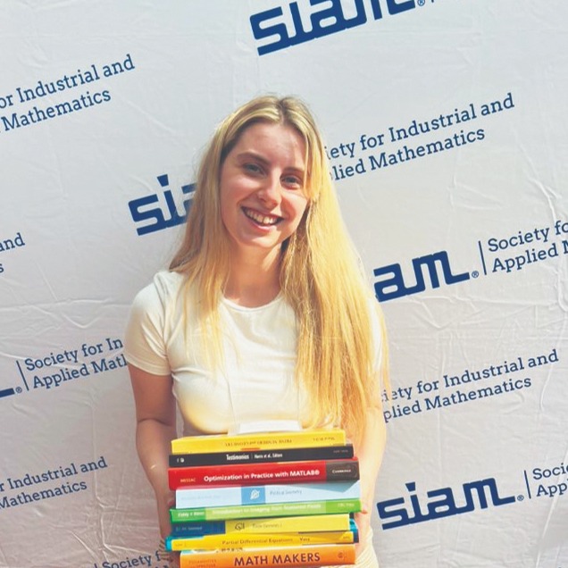 TheSIAMNews's tweet photo. In this month's issue of SIAM News, @jennypowerhour recounts her experiences at #SIAMAN22, her first international #conference. Read her recap of the #Student Chapter Breakfast, student book giveaway, and other meeting activities here! https://t.co/KkUiDHGEsZ https://t.co/CwJETz5usB