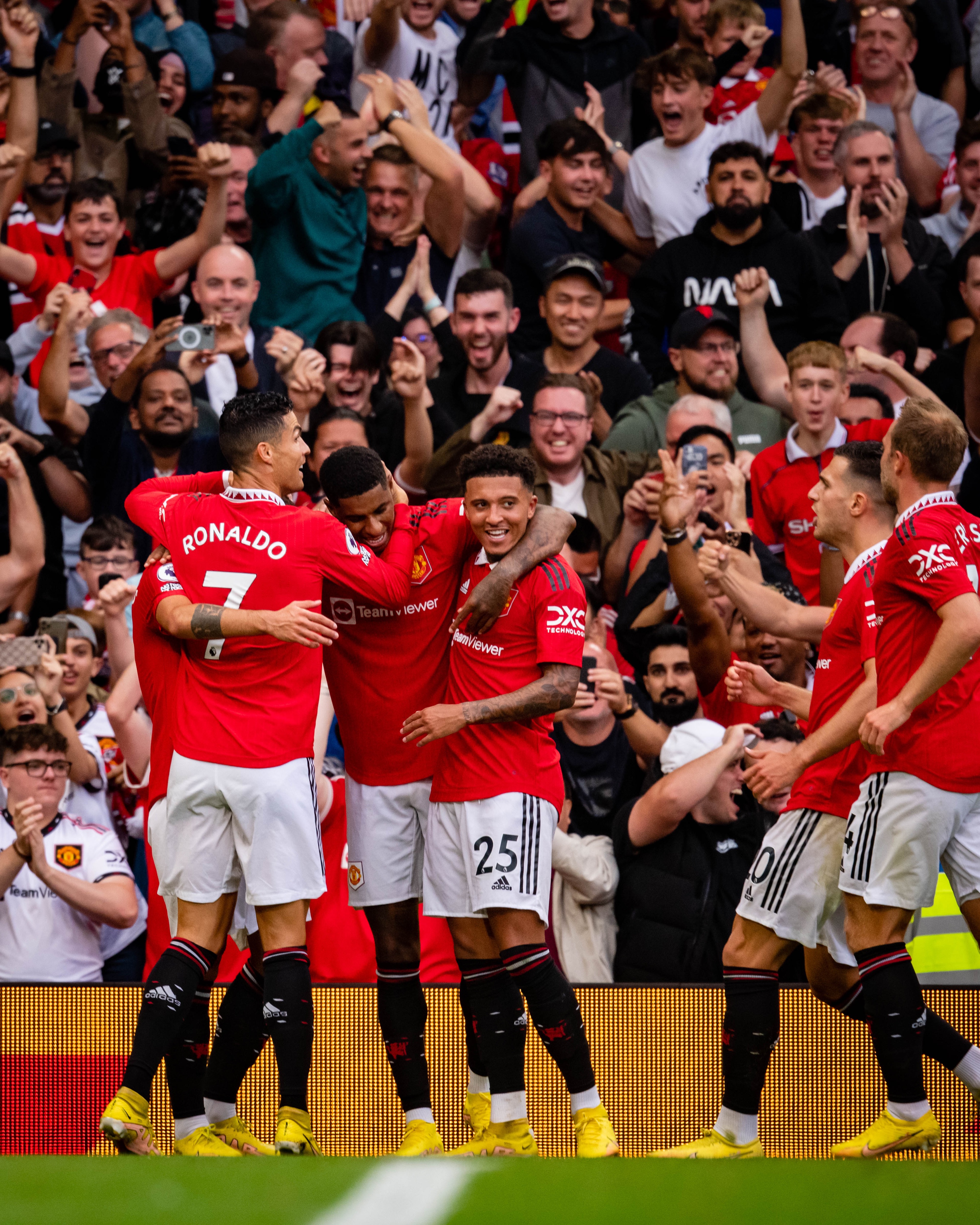 The Reds celebrate together during United's 3-1 win over Arsenal.