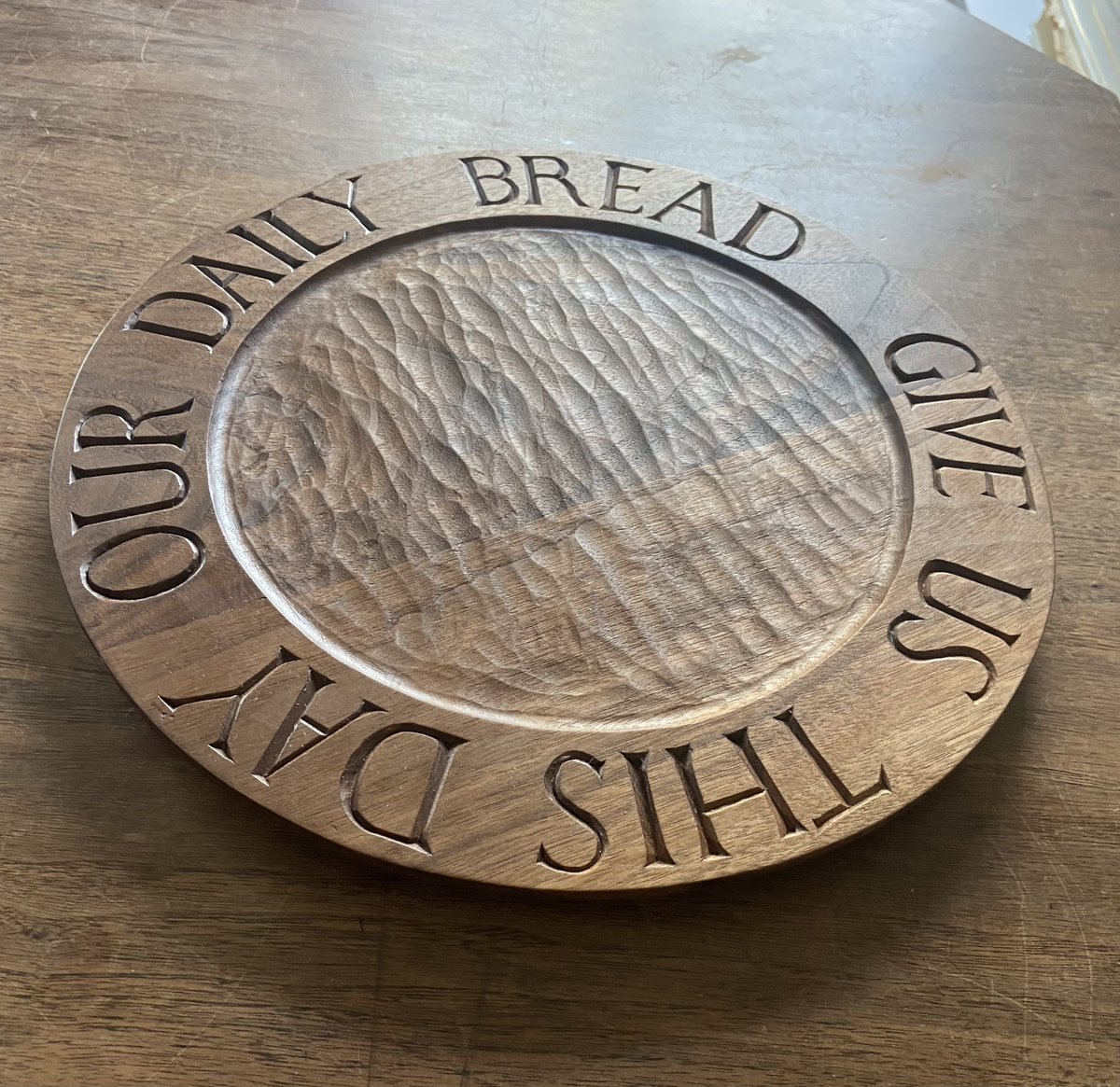 gvmcmillan's tweet photo. I’ve carved another bread plate, this one in walnut, seasoned with oil and beeswax, and is off to the client. #woodcarving #gvmstudio https://t.co/Y3JUv69Enj