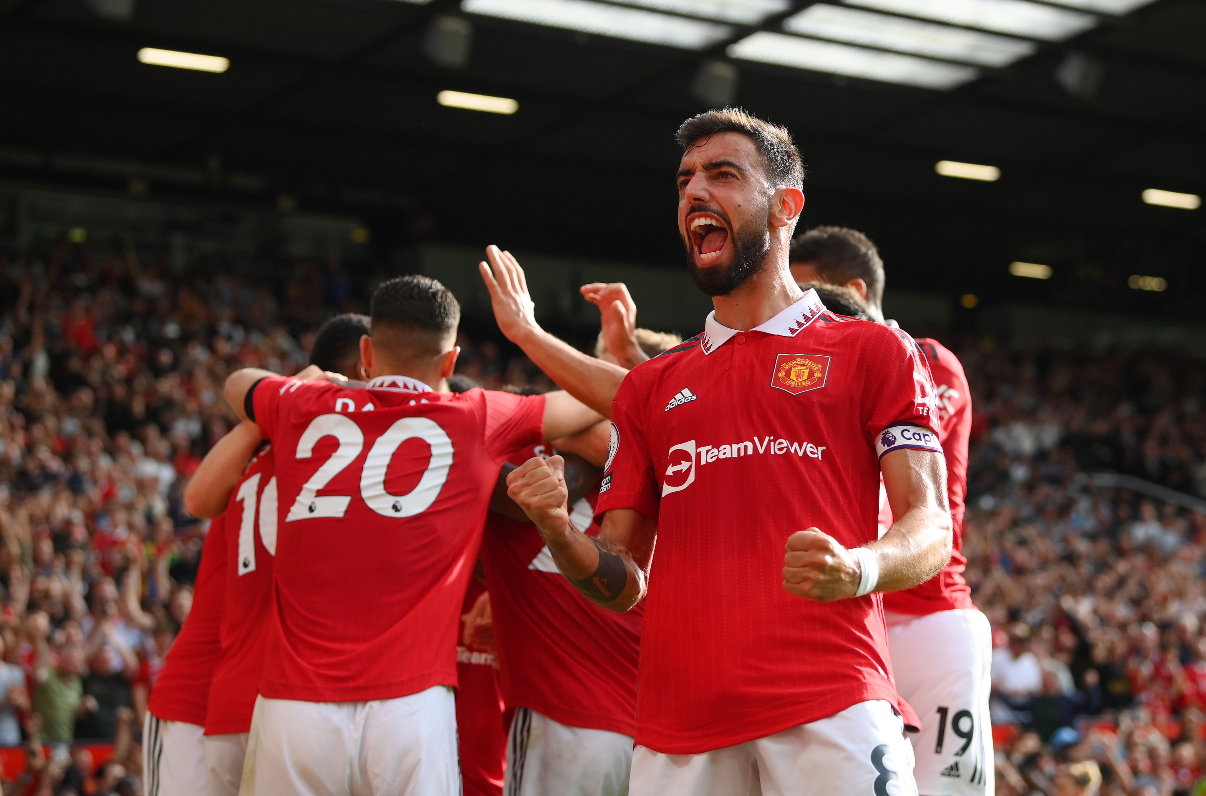 Bruno Fernandes celebrates Antony's opener at Old Trafford with the United fans and players.
