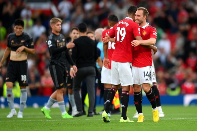 Raphael Varane and Christian Eriksen celebrate together at full-time.