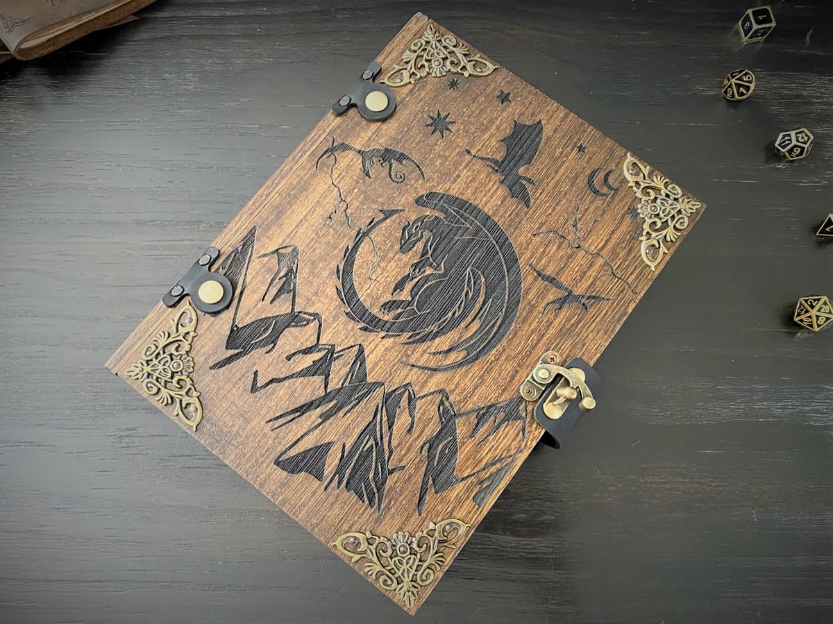 dragonburn's tweet photo. Both our Mystic & Nat20 #diceboxes look like old tomes but how are they different?
- The Mystic has decorative metal corners & uses a single-latch closure.
- The Nat20 has two leather straps riveted around the box with snaps to provide closure.
#ttrpg #dnd #dicetray #dicetome https://t.co/eocl43NANi