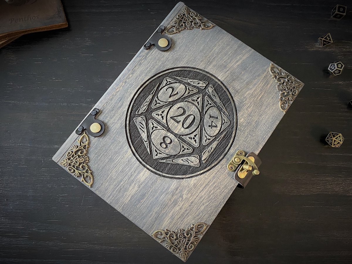 dragonburn's tweet photo. Both our Mystic & Nat20 #diceboxes look like old tomes but how are they different?
- The Mystic has decorative metal corners & uses a single-latch closure.
- The Nat20 has two leather straps riveted around the box with snaps to provide closure.
#ttrpg #dnd #dicetray #dicetome https://t.co/eocl43NANi