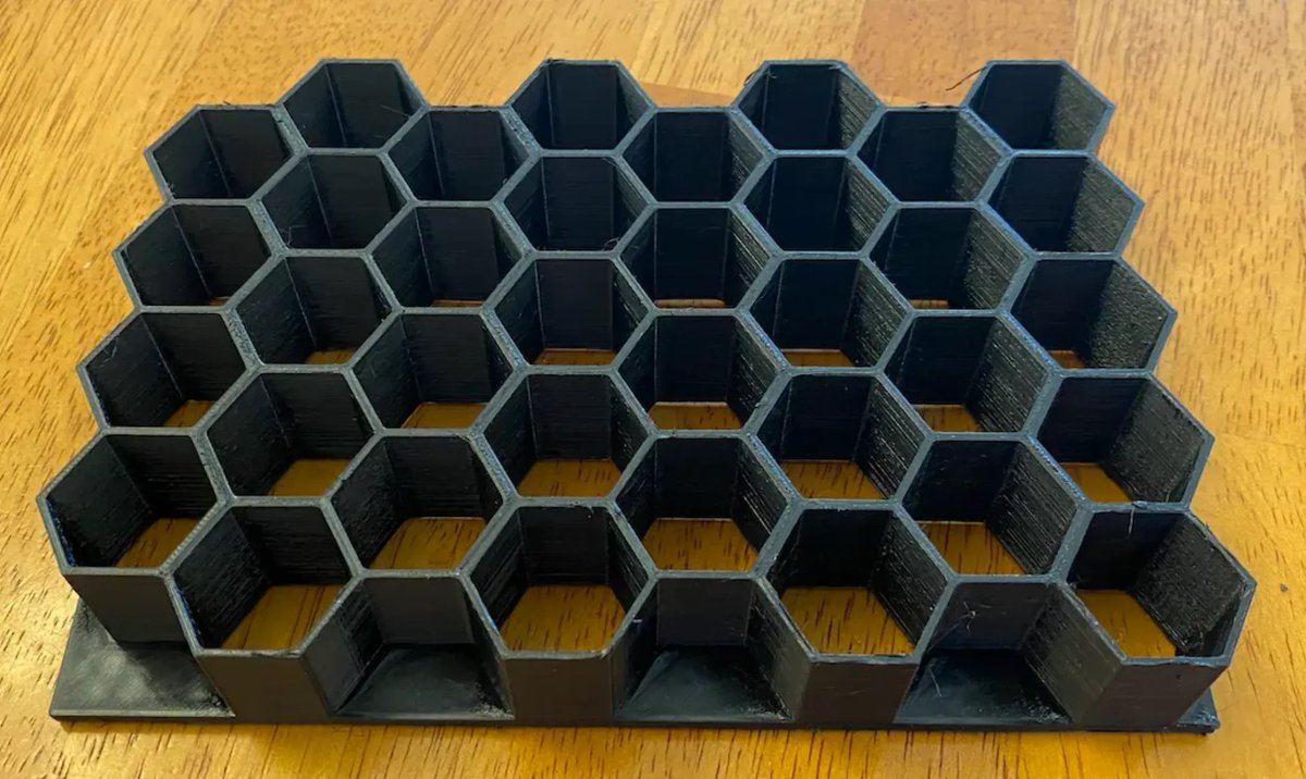 LivingDice's tweet image. I made an update to my Spellbook from @ElderwoodBoxes to  add a 36 slot honeycomb to protect my #rpg dice from hitting each other. I also posted the drawing so you can print your own if you like. printables.com/model/271249-e…