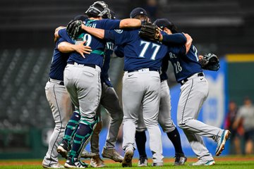 The infield celebrates with their post-game jig. 