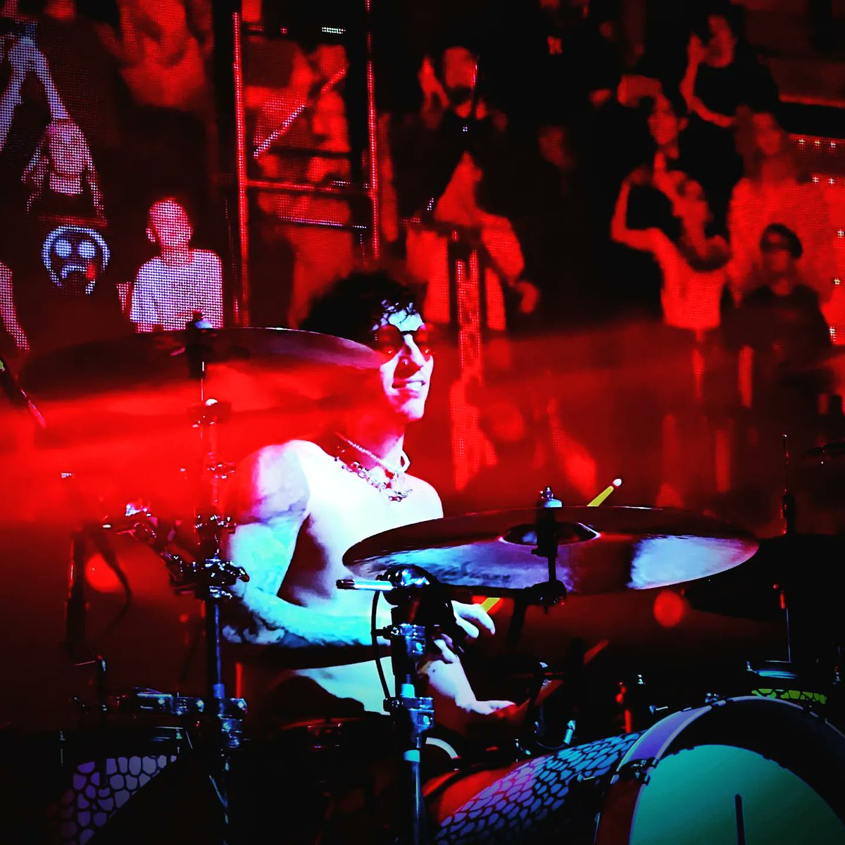 EllieRosecroft's tweet photo. Here we see @joshuadun slaying it at the #icyphilly show on the #icytour...photo 1 smiling, photo 2 having fun, photo 3 intercepting a transmission? Then in full SpookyJimChristmas mode starts calling to the mothership via his drumsticks. It was wild, man. @twentyonepilots https://t.co/ycF3ju3xOD