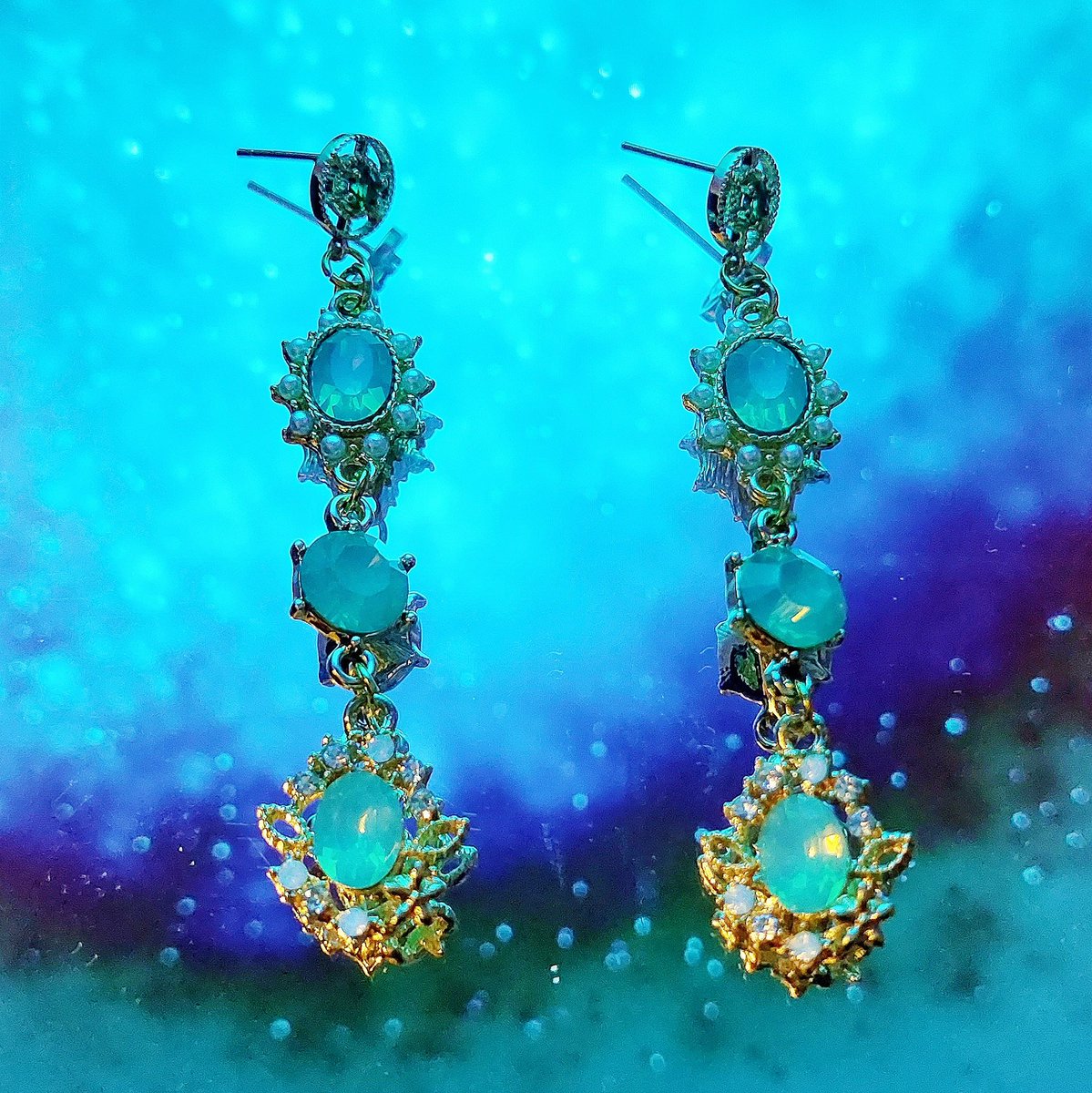 moonlitxpalace's tweet photo. This is your only chance to get 15% off one of our most expensive items! These Paris Emerald Earrings are so elegant with opals that catch the light! 💎 https://t.co/l4zmZlHjDv