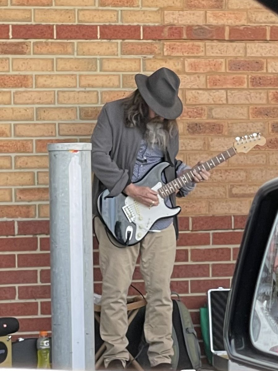 This bloke is absolutely shredding Comfortably Numb outside Kyneton Safeways at full volume.