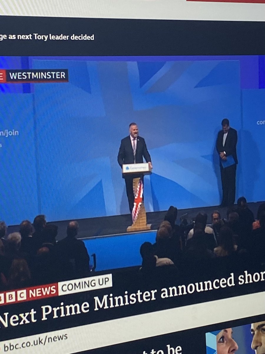 izzijsay's tweet photo. Waiting for the announcement, the podium just makes me think “Twisted Britain under Truss” - presuming it is her https://t.co/NYCPR08xoe