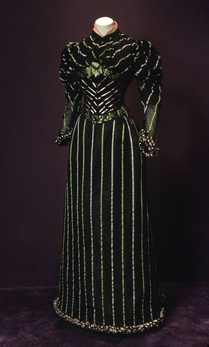 Black acts as the backdrop to stripes that seem to be neon in appearance, an electric dream of light silks outlining the length of the leg &amp; contour of the body. It dates to c1893 when dress was transitioning again to the proportions of the leg of mutton sleeve <a href="/ChicagoMuseum/">ChicagoHistoryMuseum</a>