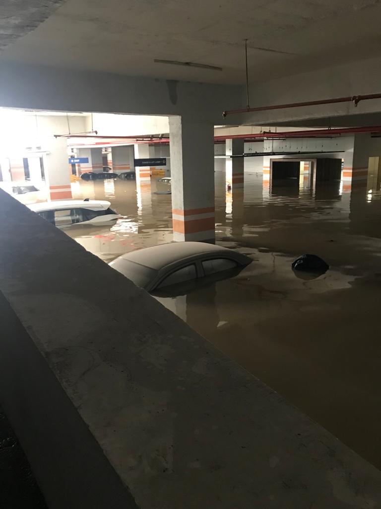 GroveeM's tweet photo. One rain and our society is flooded! Been trying to reach disaster management, BBMP helpline, ward helpline, ward engineer. Someone is on the way apparently but not reached yet! Need urgent attention to pump water from divyasree 77 place! Any help to pump water out is appreciated https://t.co/Guht2xLT2P