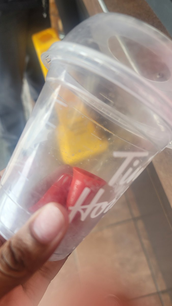 SheFreesHerMind's tweet photo. @TimHortons 

Look what I found in my ice capp. I sent a letter to you guys and no response so I'm going to have to put it put there for everyone to see. Not 1 but 2 whip cream covers were in my drink.  HOW? please explain.. https://t.co/0bEEmC3Lgk