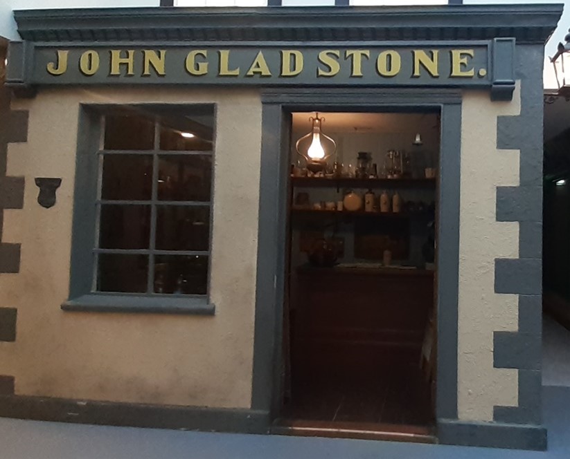 The second shop we will be visiting as part of our #JourneyThroughGladstoneCourt tour is John Gladstone, the Ironmonger. Gladstone set up his business in 1863, aged 21. The shop is filled with Victorian household items such as a bed warmer, carpet beater and mincer.