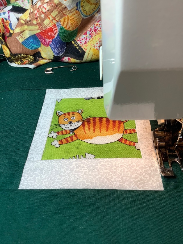 Cat Quilt under the sewing machine needle. Machine quilting! Hope you enjoy a fantastic day. #quilting #sewing #cats