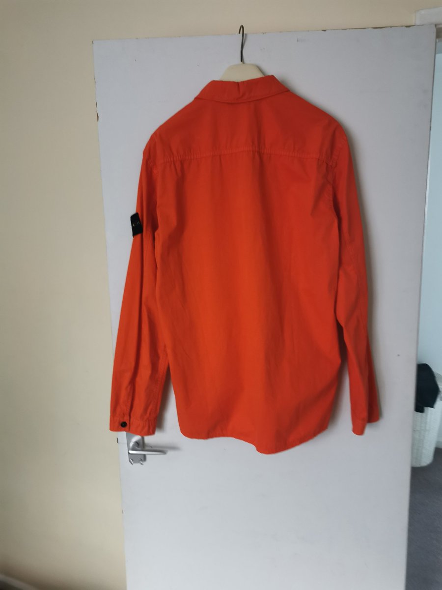 TheGuzzler72's tweet photo. Does anyone fancy taking this off my hands. Brand new stone island xl overshirt in orange. Only asking what i paid. £295 all in. DM if interested. https://t.co/wt6VnY8QWa