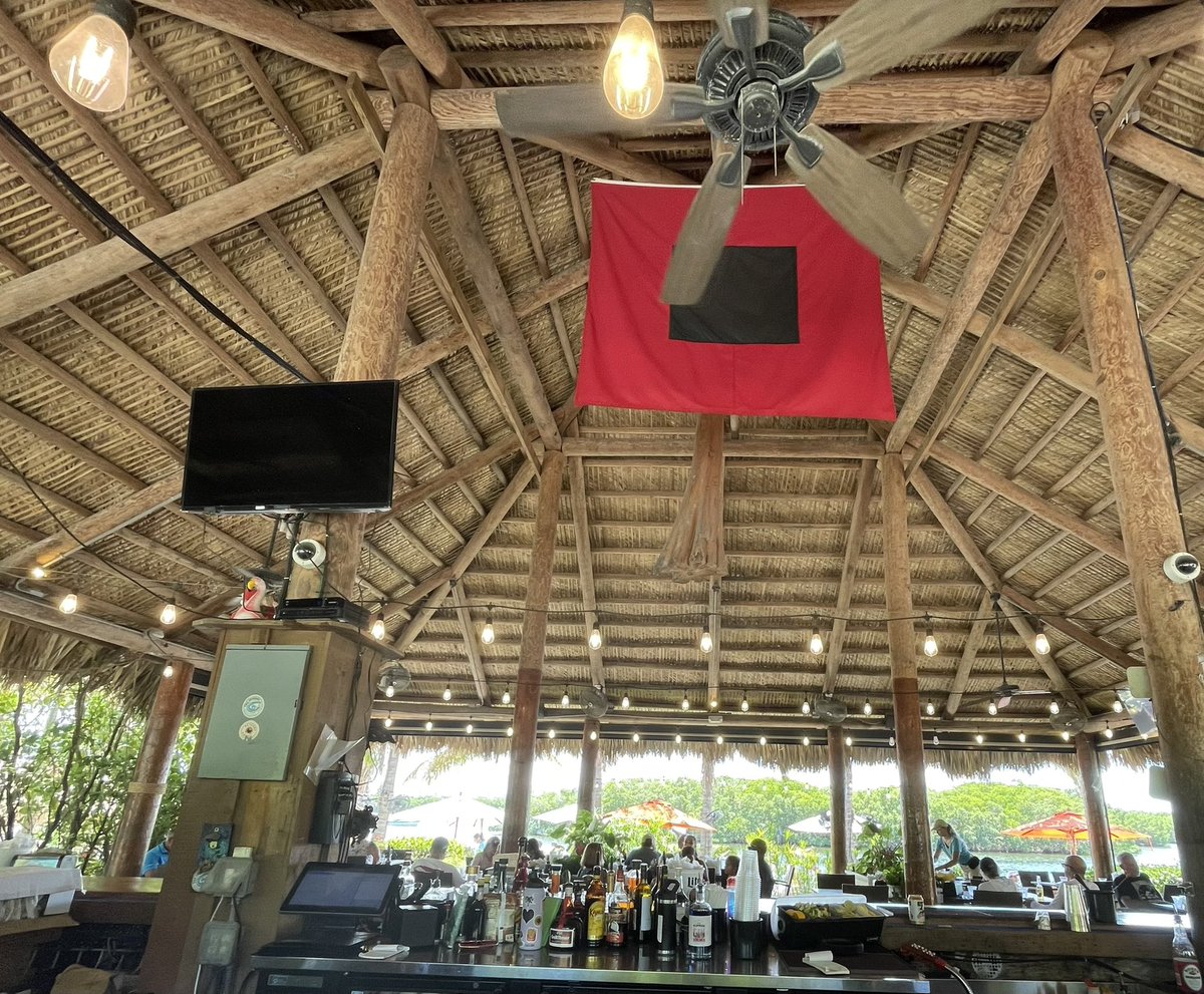 Another day, another tiki hut…where there’s always a hurricane warning. 🌀