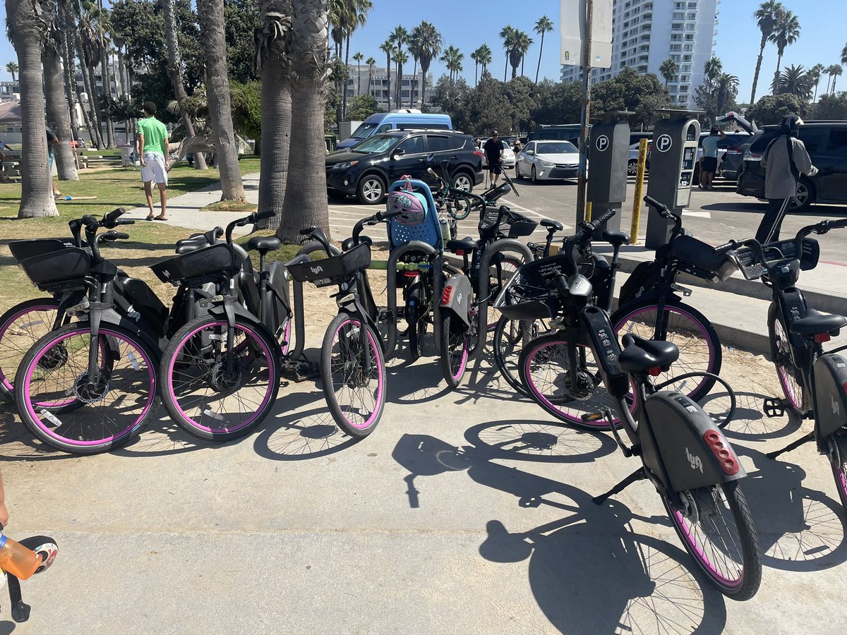 adaman797's tweet photo. @lyft Please move these bikes. They are taking every available spot on a public rack on the busiest beach day of the year. On the Santa Monica beach bike path near Ocean Park Blvd. and Barnard Way. https://t.co/VYRfFrCcy7