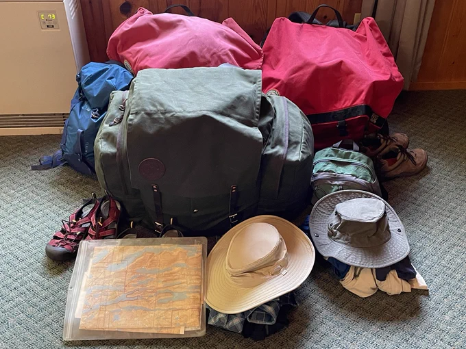 It fit! The same pile of gear now neatly packed into 3 canoe packs. 