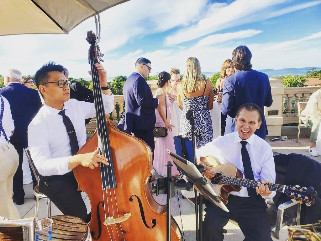 Neat photo of me and <a href="/mark/">mark</a>.alan.davidson! 
📸: @bassbugler 
<a href="/hipshotband/">Hipshot Band</a> 
#musician #musicianlife #wedding #cocktailhour #acoustic #jazz instagr.am/p/CiJAvGdpDQW/