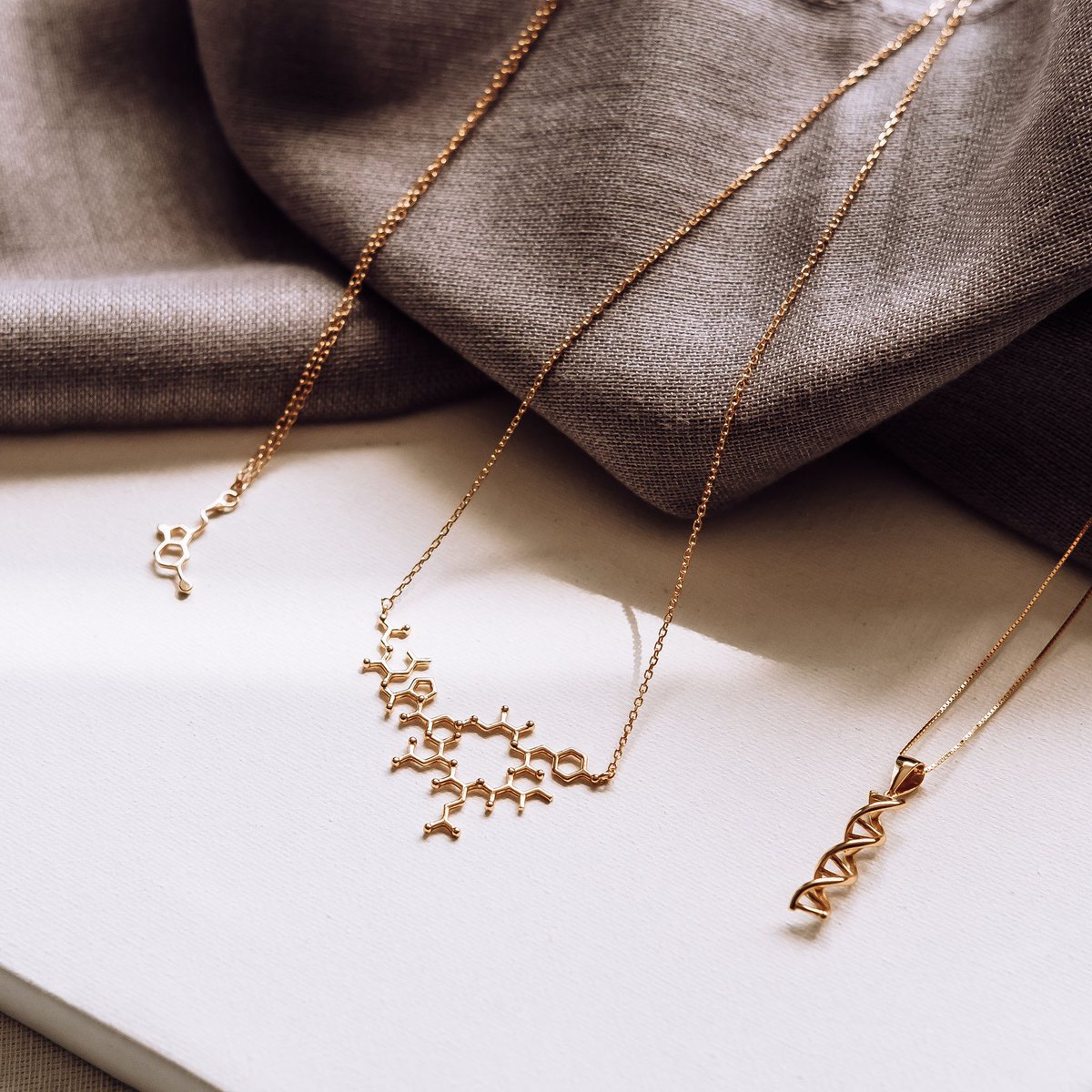 GiftChemical's tweet photo. Three of our faves in gold ✨

Serotonin, oxytocin and DNA 🧬 https://t.co/ZPlhdFq6xA