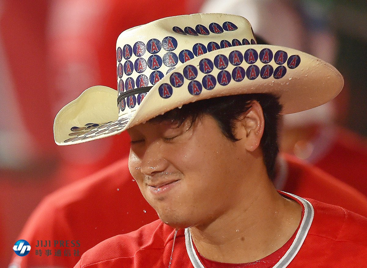 shodoingthings's tweet photo. shohei ohtani getting splashed with water after hitting his 31st and 32nd home runs in the same game https://t.co/1BHWALi1RO