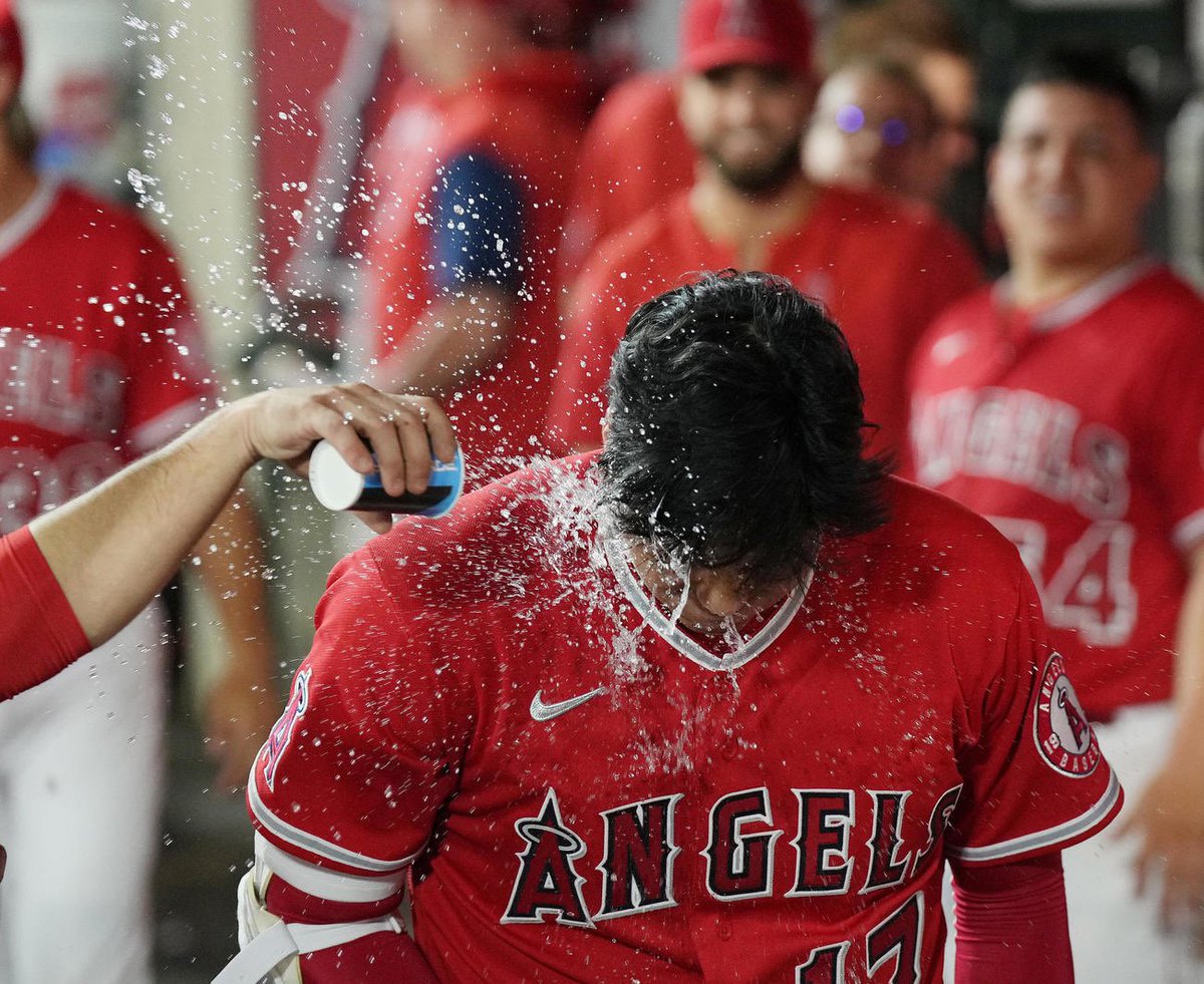 shodoingthings's tweet photo. shohei ohtani getting splashed with water after hitting his 31st and 32nd home runs in the same game https://t.co/1BHWALi1RO