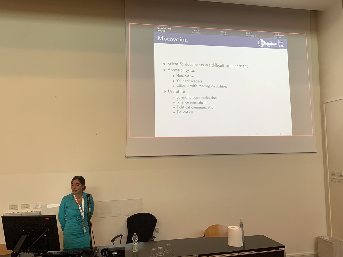 frrncl's tweet image. Liana on stage again presenting the SimpleText lab on (automatically) simplifying scientific documents for non-native speakers, youngers and more #clef2022 @clef_initiative