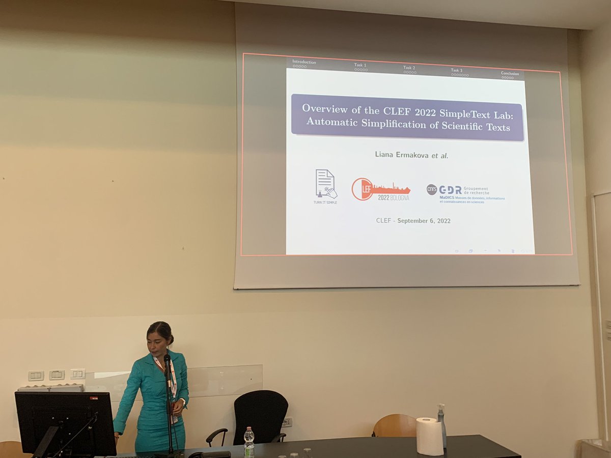 frrncl's tweet image. Liana on stage again presenting the SimpleText lab on (automatically) simplifying scientific documents for non-native speakers, youngers and more #clef2022 @clef_initiative