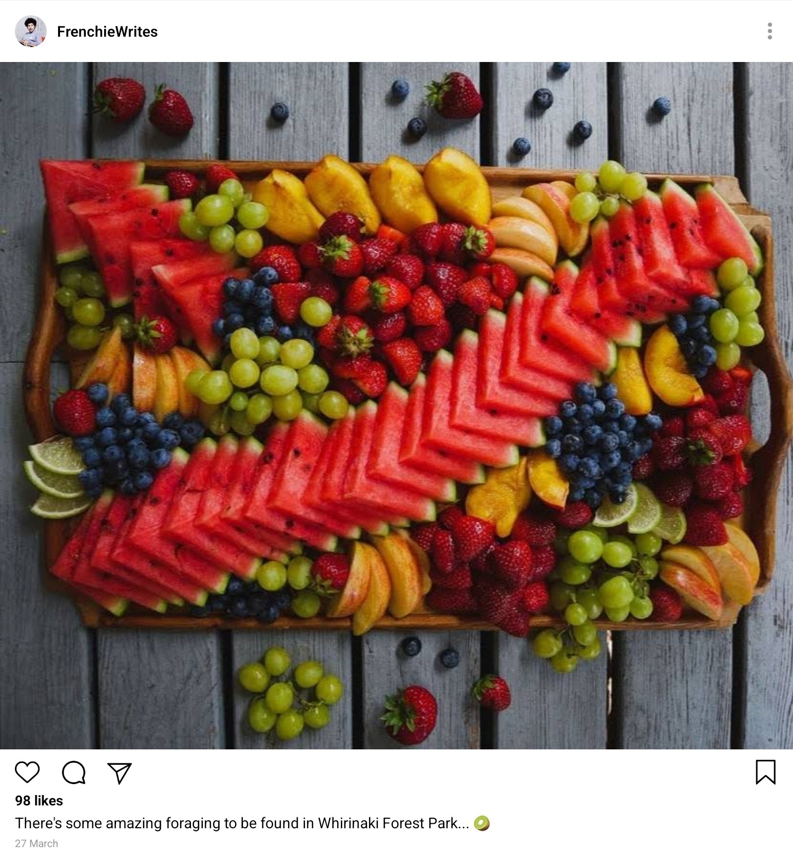 A post on Frenchie;s Instagram account, FrenchieWrites. It's a photo of Stede's ornate fruit tray. Caption reads "There's some amazing foraging to be found in Whirinaki Forest Park... (kiwi emoji)