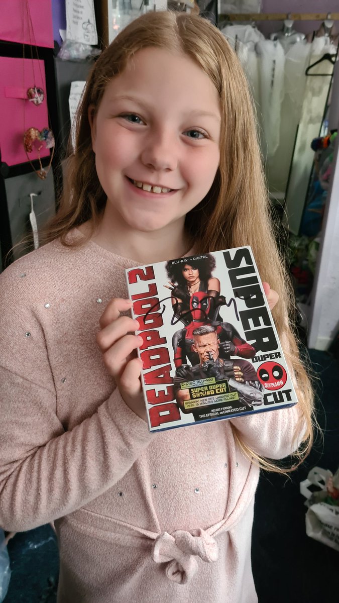 GlitterBombRobo's tweet photo. Jazzy won  @mad4movieswxm raffle for #ITP charity and got a @VancityReynolds signed DVD.
She is so happy😃 but she will have to wait a few years to watch it.
Well done Rob Clarke for organising and raising so much 💰 for this charity thats so close 2 his❤️ #wrexham #WrexhamAFC https://t.co/1yV33WmGVc