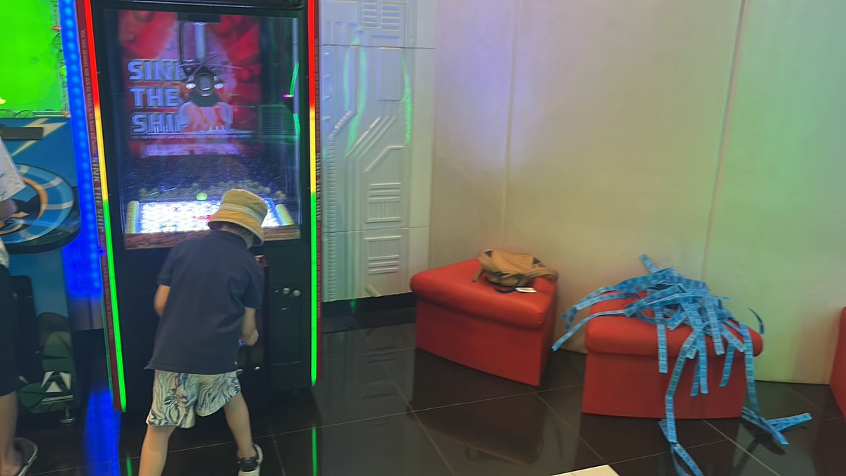 Gary_Dzen's tweet photo. My 6 yr old. First he tried all games once but has been playing only this one for 40 mins now. Others are more fun hes says. But look at the pile of prize tickets. He understood that this game is the most ticket-efficient so lost all motivation for other games. #PLAYTOEARN #P2E https://t.co/HhqpEjMU2a