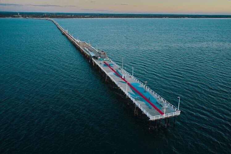 WestAustralia's tweet photo. Rolling out the ❤️ carpet @MargaretRiver-style for this week’s @cinefestoz… 1.8km out to 🌊 on @BusseltonJetty! 🐋

#WanderOutYonder #SeeAustralia https://t.co/UTbztG9PbB