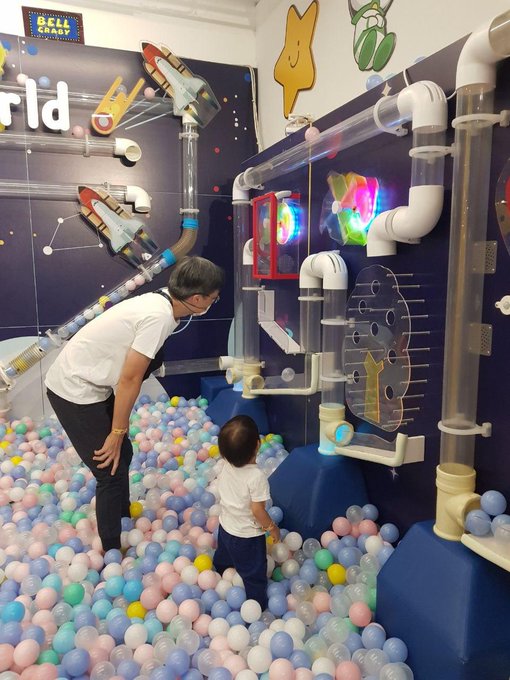 Photo of me and my boy playing in a ball pit