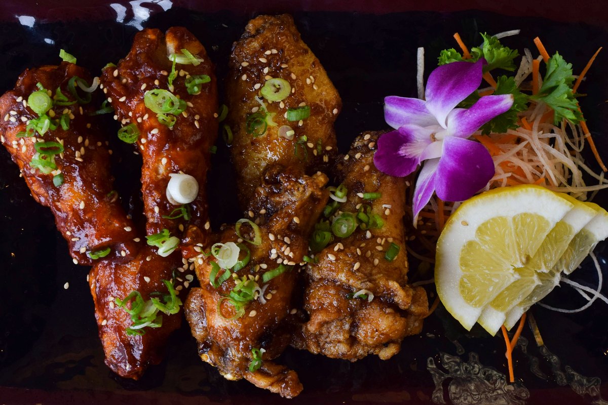 These wings look almost as delicious as they taste! 

You can enjoy our wings with the sauce of your choice — spicy BBQ, sweet soy, or siracha!