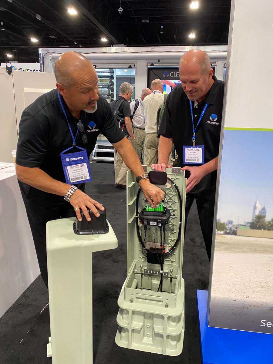 ClearfieldFiber's tweet photo. Johnny Hill (COO) and Paul Kmit (Technology Platform Manager) investigate our new CraftSmart FiberFirst Pedestal. Stop by Clearfield booth 613 at #ISEEXPO, say hello and see it for yourself! https://t.co/HsYrpiDJEx @ISE_Magazine #ISEEXPO2022 #ISEEXPO22 https://t.co/QxLbYAhpz4
