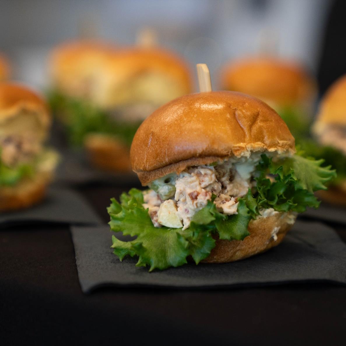 Looking for a quick party dish? Crafted by @chefcliffpleau, the Chicken Krunch Slider features Kalera Krunch lettuce, celery hearts, granny smith apples, pecans and pimiento cheese. This sandwich is an easy addition to your next get-together!