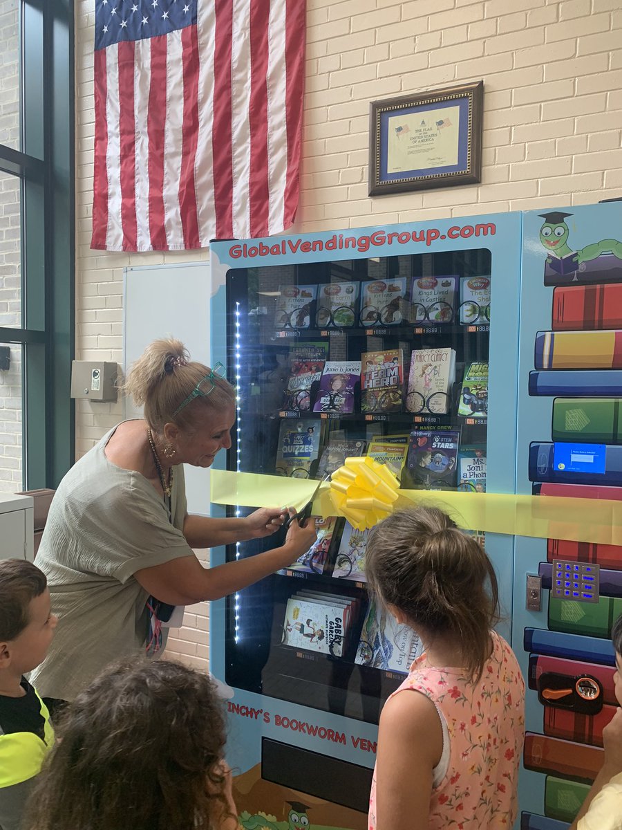 D123Sward's tweet photo. Ribbon cutting for our very own BOOK VENDING machine 📚🎉. Thank you to our Sward PTA and the D123 ED Foundation for supporting this student centered initiative. @d123_ed @MrsKramerD123 @GlobalVending #bookwormmachine #keepkidsreading #books #d123 #swd123 https://t.co/bzhJG5hHtZ