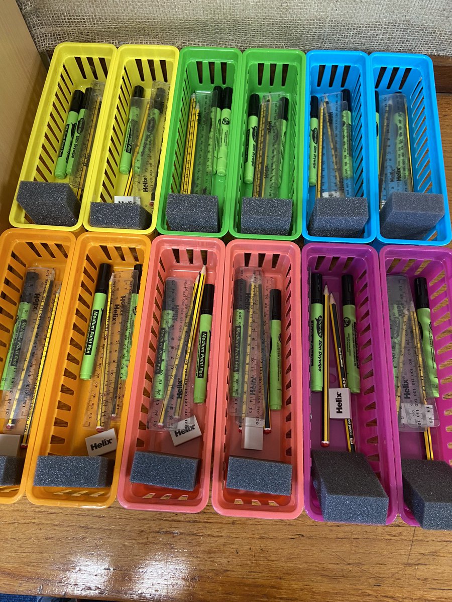 My classroom is pretty much done now and these thin baskets are my purchase of the year. Big enough to fit everything that 2 pupils will need (glue sticks pending) and small enough to not get in the way.