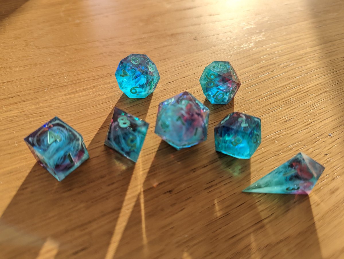 mattimooz's tweet photo. @kuuriimu made me these absolutely stunning dice, a commissioned Southern Owl design. I am absolutely failing to capture the wonderful swirls and glorious colours but the sun was shining today so I tried. https://t.co/rm3NDnQVPm