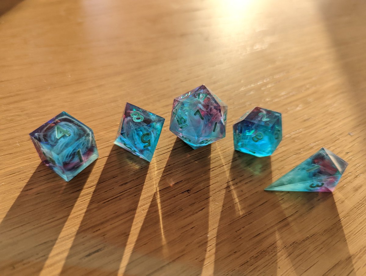 mattimooz's tweet photo. @kuuriimu made me these absolutely stunning dice, a commissioned Southern Owl design. I am absolutely failing to capture the wonderful swirls and glorious colours but the sun was shining today so I tried. https://t.co/rm3NDnQVPm