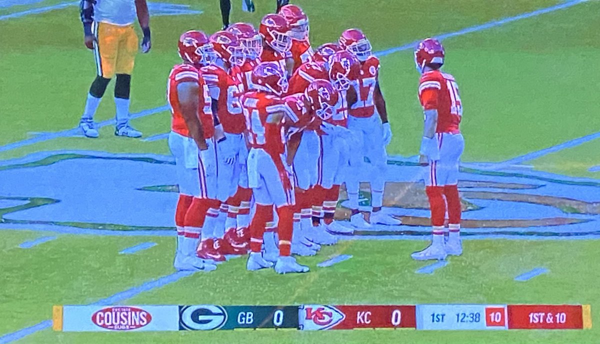 ByRyanWood's tweet photo. Patrick Mahomes on the field for a choir huddle in tribute to the late Len Dawson before Chiefs first snap tonight. Chiefs took a delay-of-game penalty, which #Packers declined, and then Mahomes went back to the sideline. Cool moment. Class on both sides. https://t.co/pEEov9ooCn