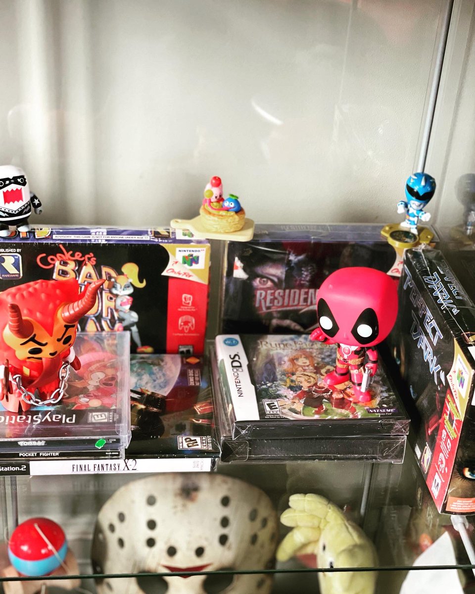 Kanekuso's tweet photo. Got my display case setup in FULL FORCE 👹 #displaycase #videogames #PS2 #ps1 #fighting #sealed #pokemon #gaming #games #collection #hobby #collecting #collector https://t.co/iPcHyj3YjE