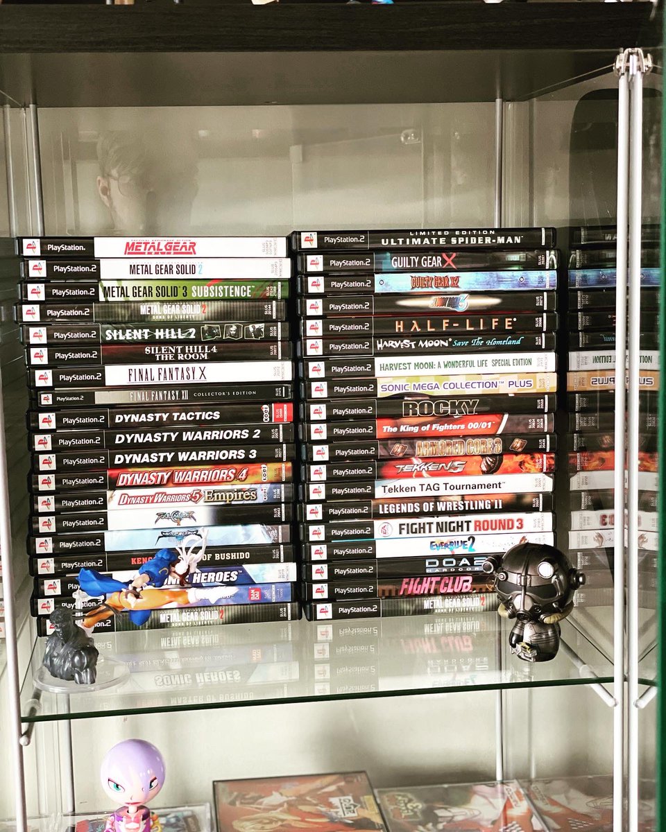 Kanekuso's tweet photo. Got my display case setup in FULL FORCE 👹 #displaycase #videogames #PS2 #ps1 #fighting #sealed #pokemon #gaming #games #collection #hobby #collecting #collector https://t.co/iPcHyj3YjE