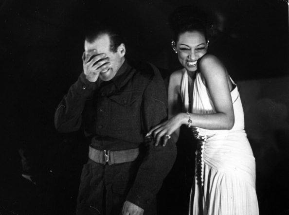 I LOVE this picture.
Josephine Baker, a hero in so many ways, having a little giggle with a shy army lad in London during the war.