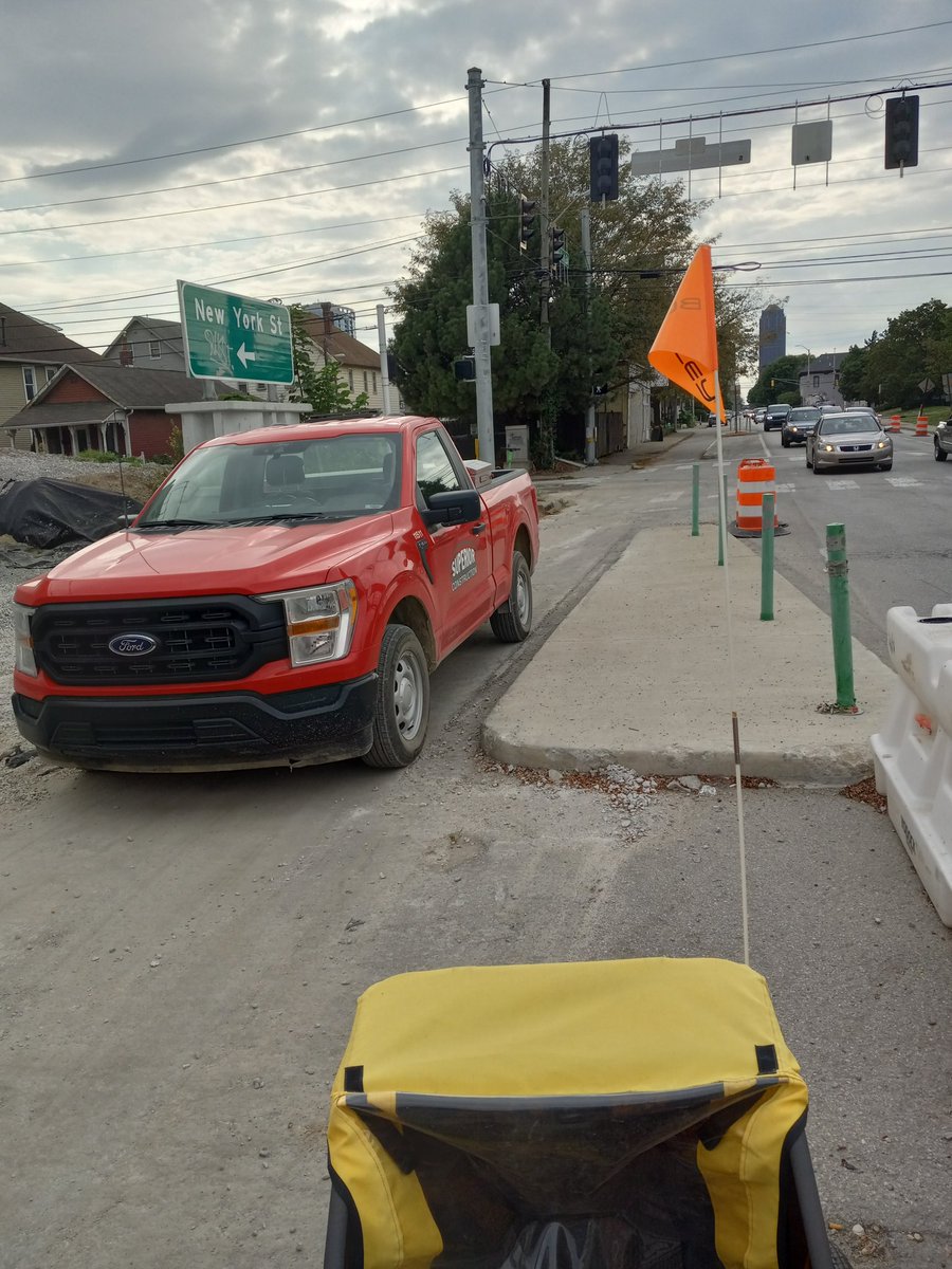 EricMBurgeson's tweet photo. @superior1938 Can we talk about unblocking the bike lane on New York under tomorrow night?  Pulling up the pickups would have solved it. https://t.co/WAACzBmmSV