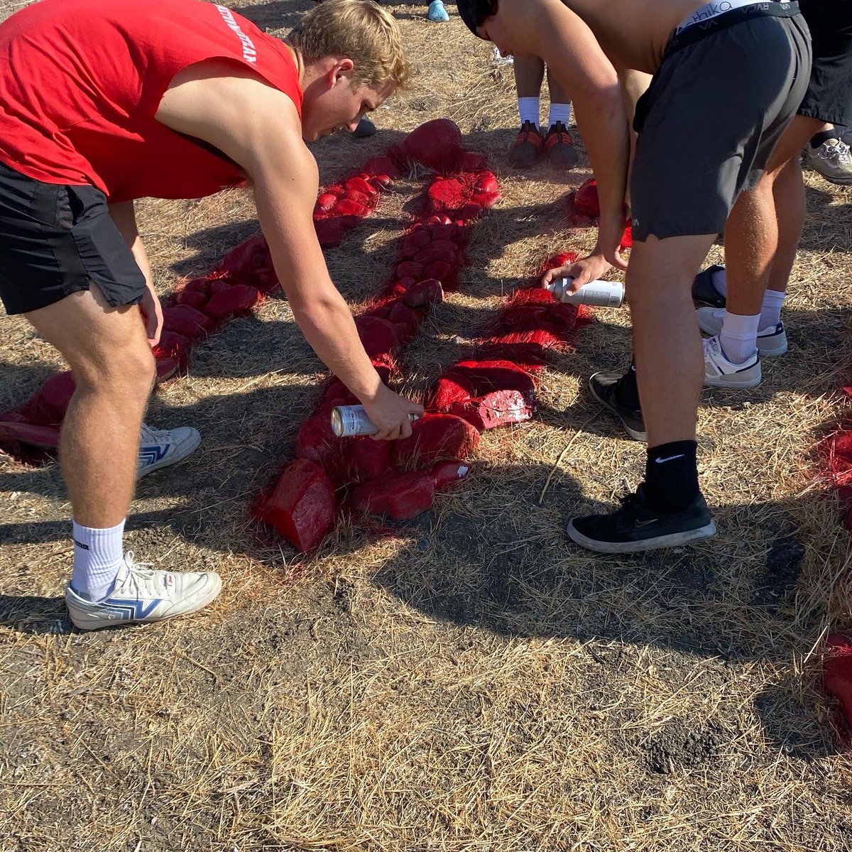 Tritonfootball's tweet photo. It has become a yearly tradition for our seniors to paint our NP in honor of Nick Pasquale.   We take a moment to talk about Nick and what he meant to our program.  We will continue to honor Nick on and off the field!  Love you NP! 🙏❤️🖤 #36 #10 #livelikenick  @CoachJimMoraFB https://t.co/IttnJxyer7
