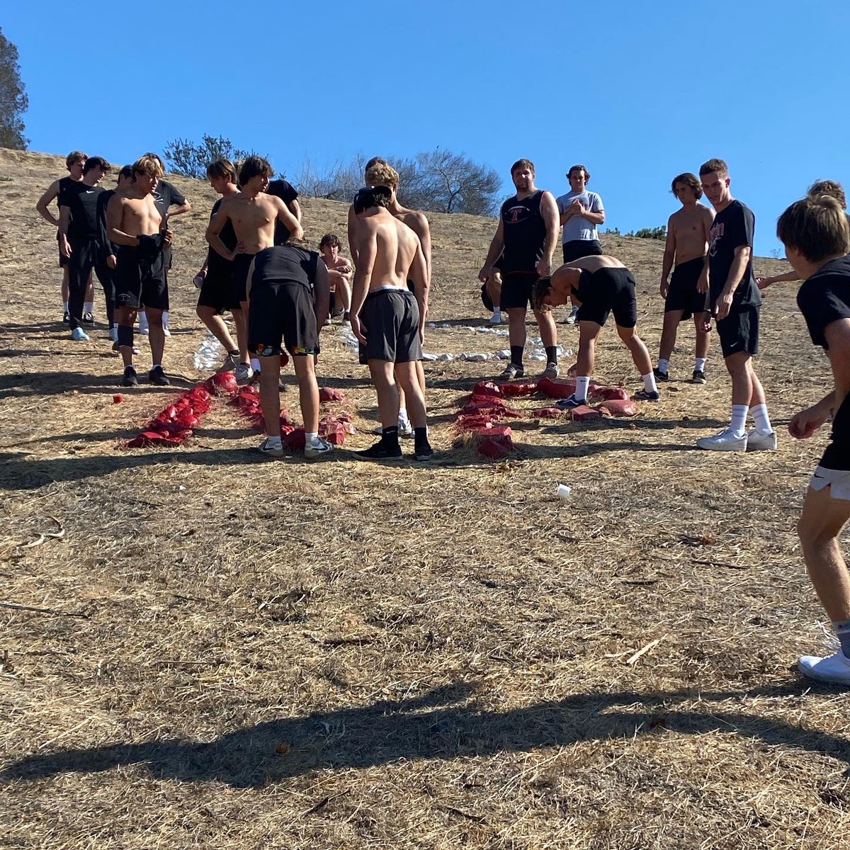 Tritonfootball's tweet photo. It has become a yearly tradition for our seniors to paint our NP in honor of Nick Pasquale.   We take a moment to talk about Nick and what he meant to our program.  We will continue to honor Nick on and off the field!  Love you NP! 🙏❤️🖤 #36 #10 #livelikenick  @CoachJimMoraFB https://t.co/IttnJxyer7
