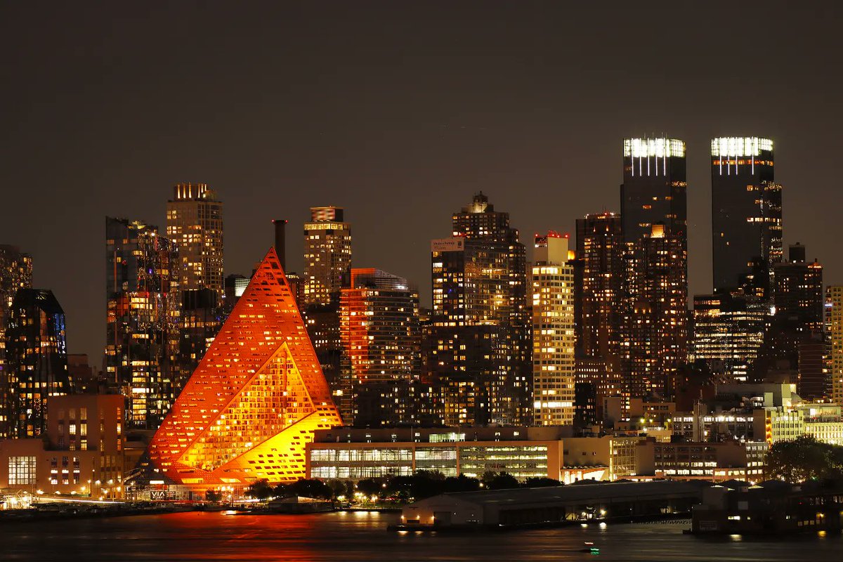 GaryHershorn's tweet photo. So they lit Via 57 West in orange as part of a promotion with Doritos where triangular buildings around the world will be illuminated to look like a chip. It actually looks cool here in New York City #newyork #newyorkcity #nyc @agreatbigcity @Doritos @via57west https://t.co/d1pk8gmp9o