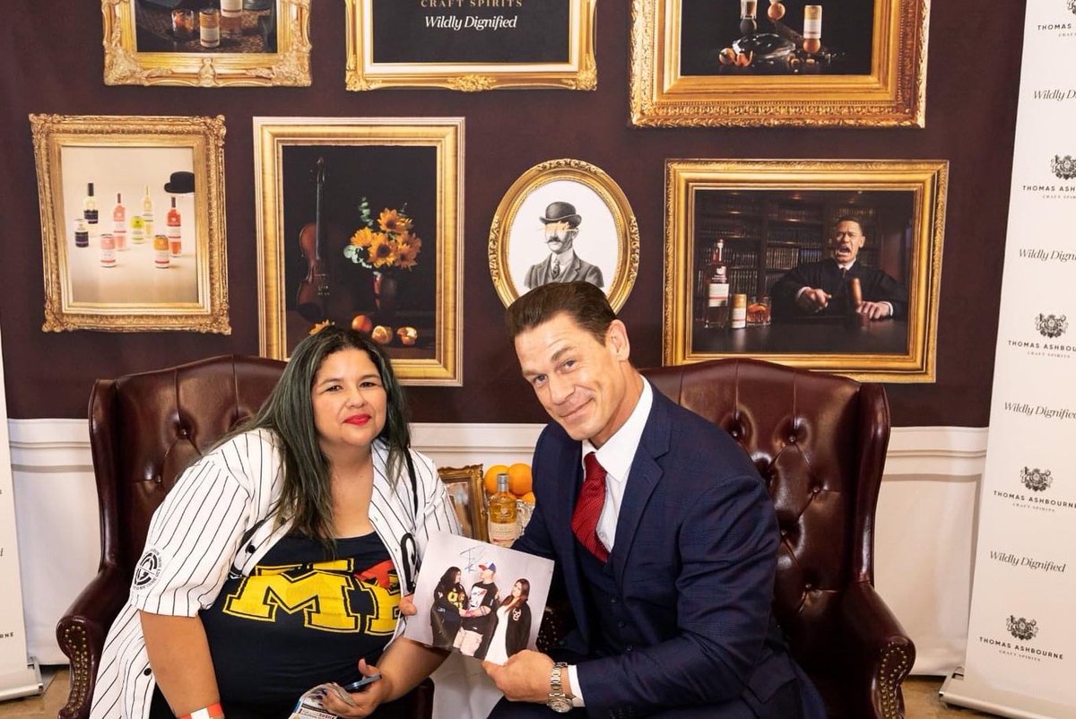 cenagirl99's tweet photo. My pics with @johncena at the @thomasashbourne event ❤️ What a great time this was! I love how he loved seeing and holding up our pic from years back lol plus I made sure to tell him I’ve loved him for 20 years since the chain gang and #basicthuganomics 🥰 Thank you so much!!! https://t.co/5vgekWcRIy