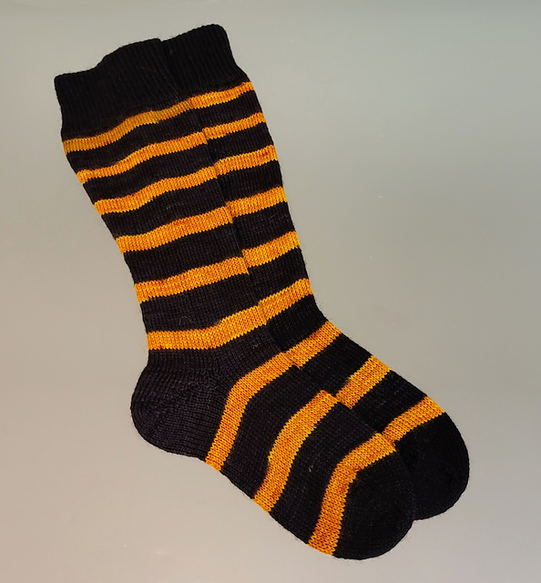 WonderWmn212's tweet photo. Made these for a very special Hufflepuff's birthday. Used Simply Sock Poste (Wizard Loyalty) and Kroy Sock. Comfortable making these knowing that, because nothing was licensed, no $ went to JKR. #Knitting #knit #FOFridayOffRav #knittingtwitter #knitsocks https://t.co/0lIyDFKT0C